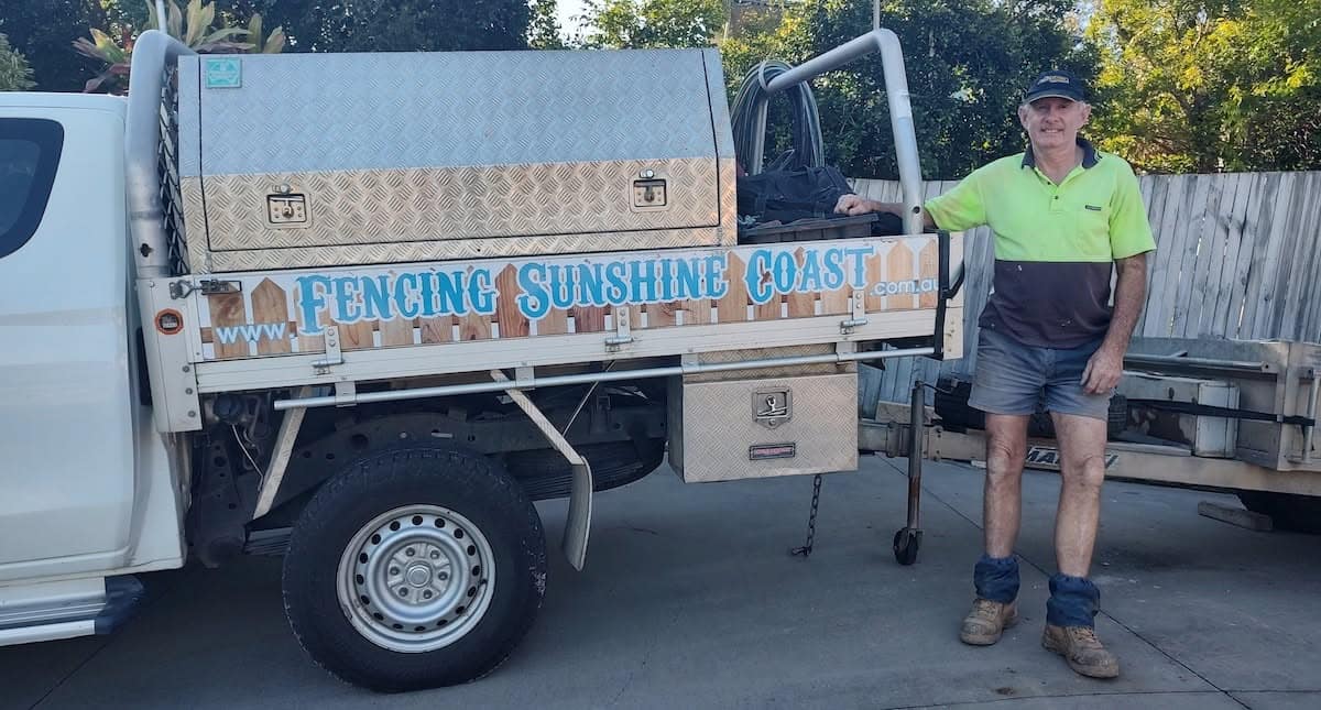 Lindsay Catlin beside the Fencing Sunshine Coast work ute on the job